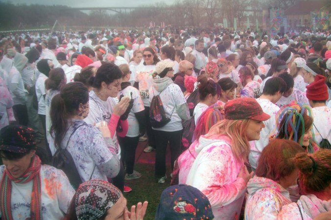 Lots of colored cornstarch flying through the air, ensuring everyone has been dyed before the race begins